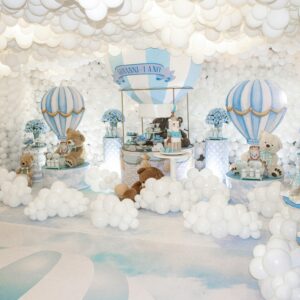 A playful teddy bear themed birthday setting with balloons and pastel colors, perfect for children's parties.