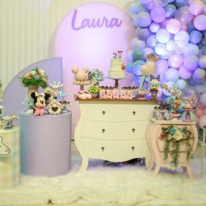 A vibrant Minnie Mouse themed birthday setup with balloons and decor.