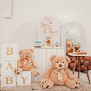Delightful baby shower setup featuring plush teddy bears, decorative blocks, and tasty treats creating a festive atmosphere.
