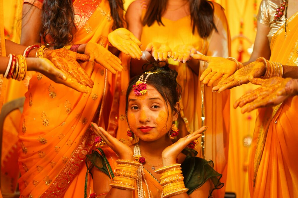 Joyful portrait capturing the essence of a traditional Indian haldi ceremony.
