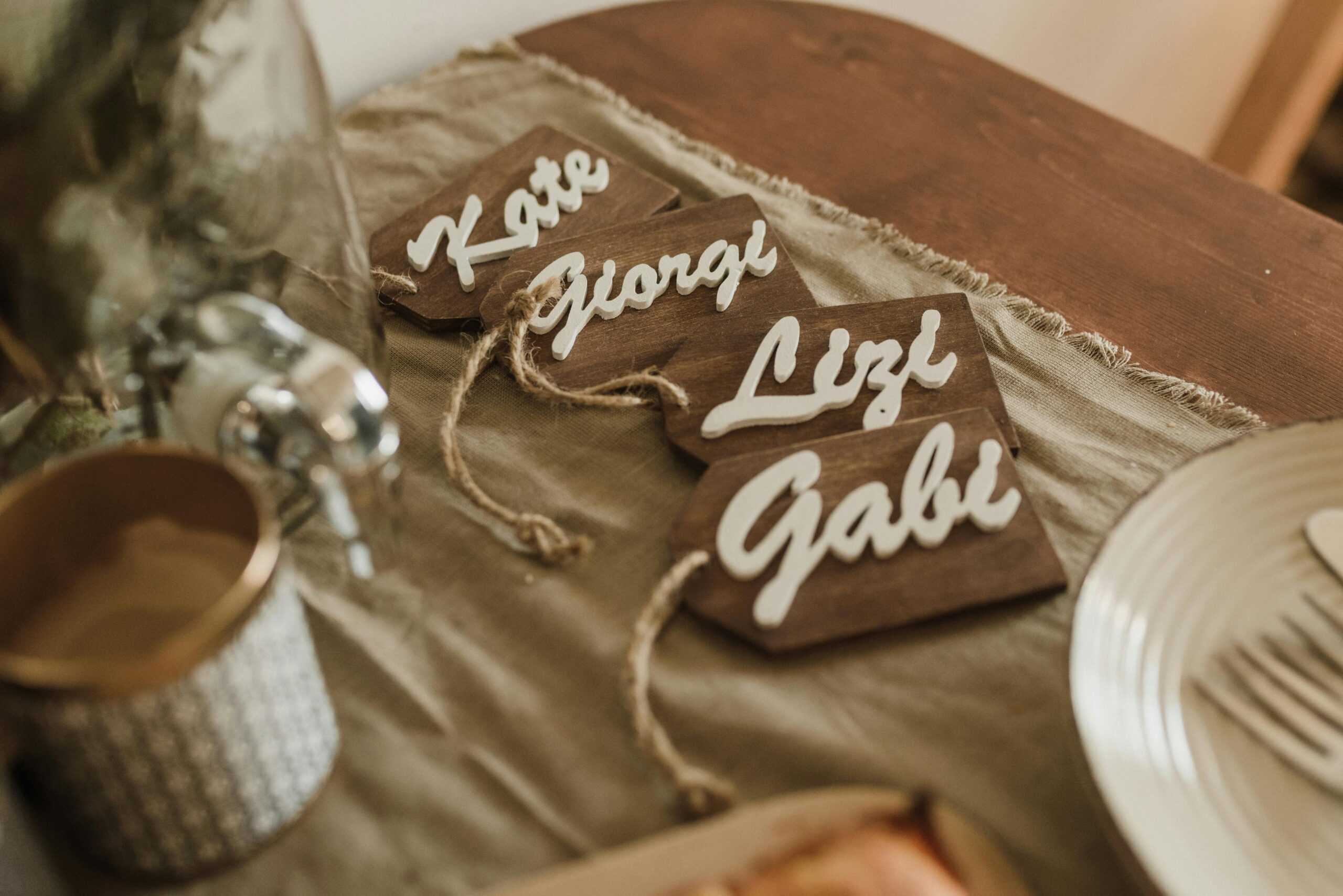 pexels photo 6338787 6338787 Elegant dining table setup with personalized wooden name tags adding a warm touch to any special occasion.