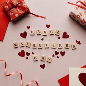 Celebratory Valentine's Day decor with gifts, hearts, and love notes.