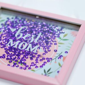 Pink shadow box with floral design and sequins, perfect gift for Mother's Day.